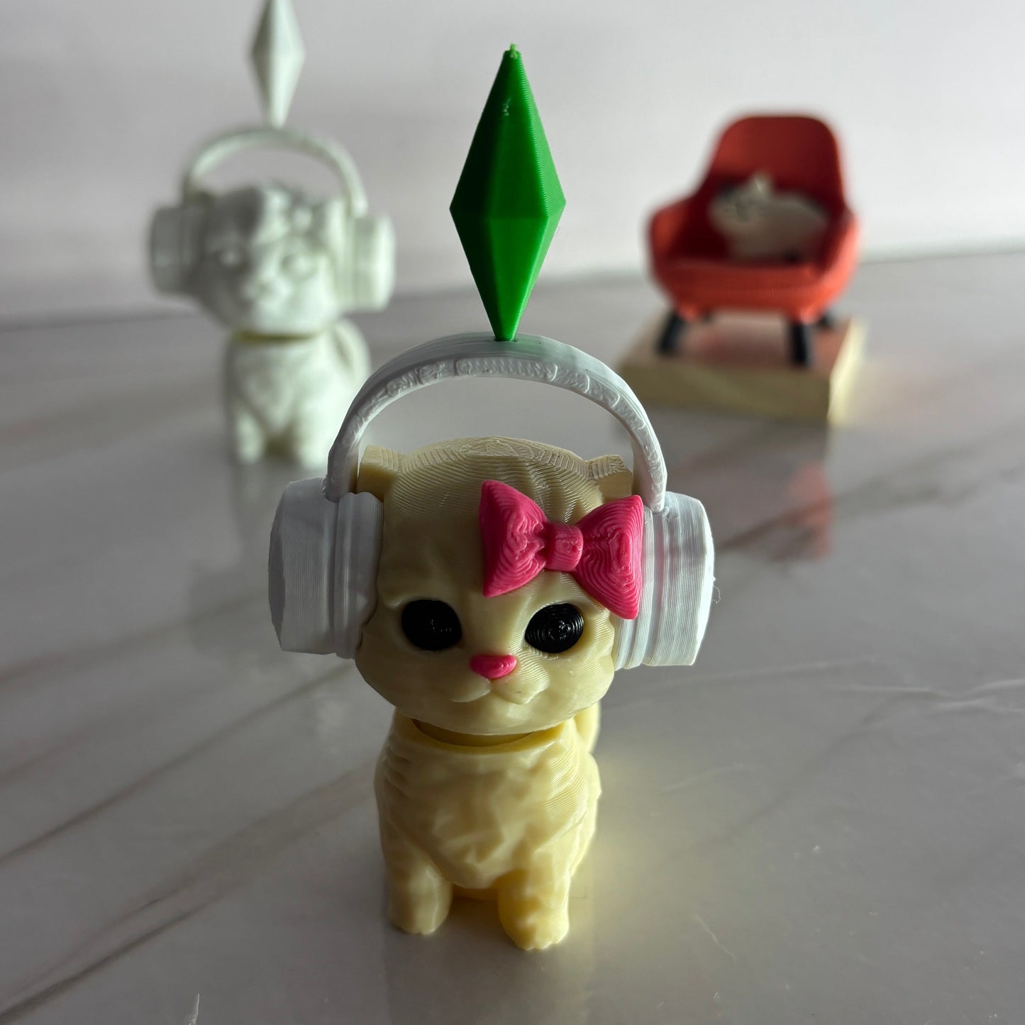 Small figurine with headphones and a bow on a reflective surface