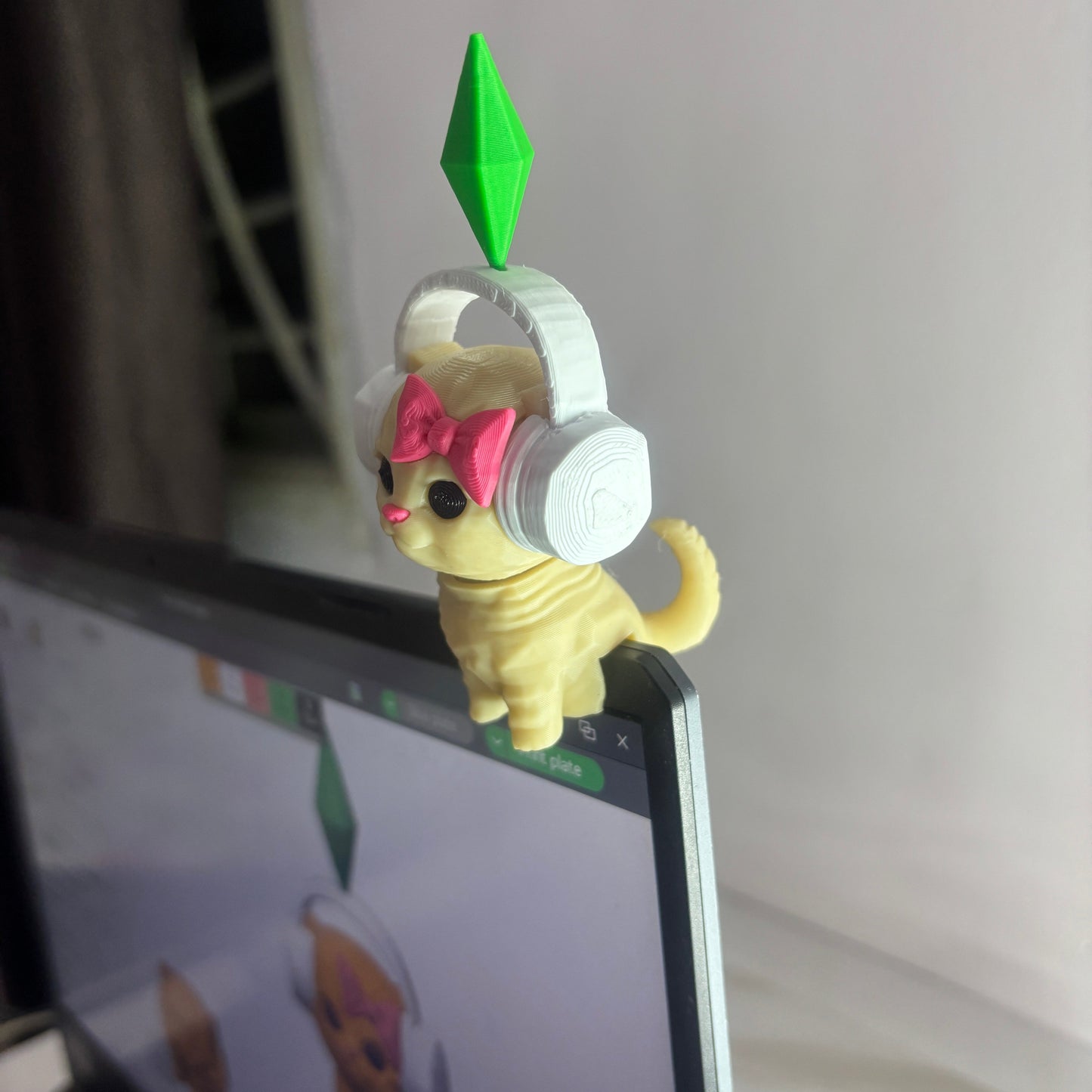 Phone case with cartoon character on a laptop screen