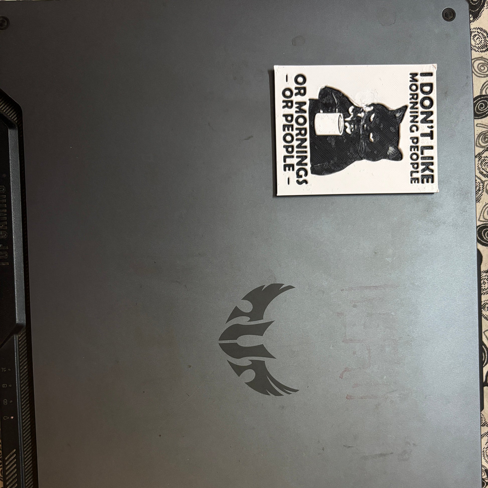 Laptop with a sticker on the back